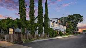 A two-story building with a sign indicating it is a bed and breakfast. - Discover the charm of Colonial Beach (Colonial Beach)