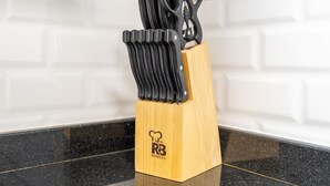 A kitchen knife block with a logo on it. - Luxe 4bed Apt Dubai Marina JBR Pool by Belvilla (Dubai)