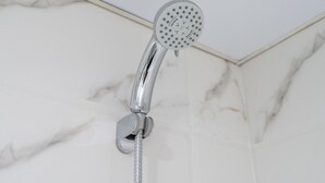 A showerhead with a flexible hose attached to a wall-mounted fixture. - Luxe 4bed Apt Dubai Marina JBR Pool by Belvilla (Dubai)