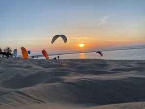 Enjoy kite flying on the undulating sand dunes overlooking the ocean.