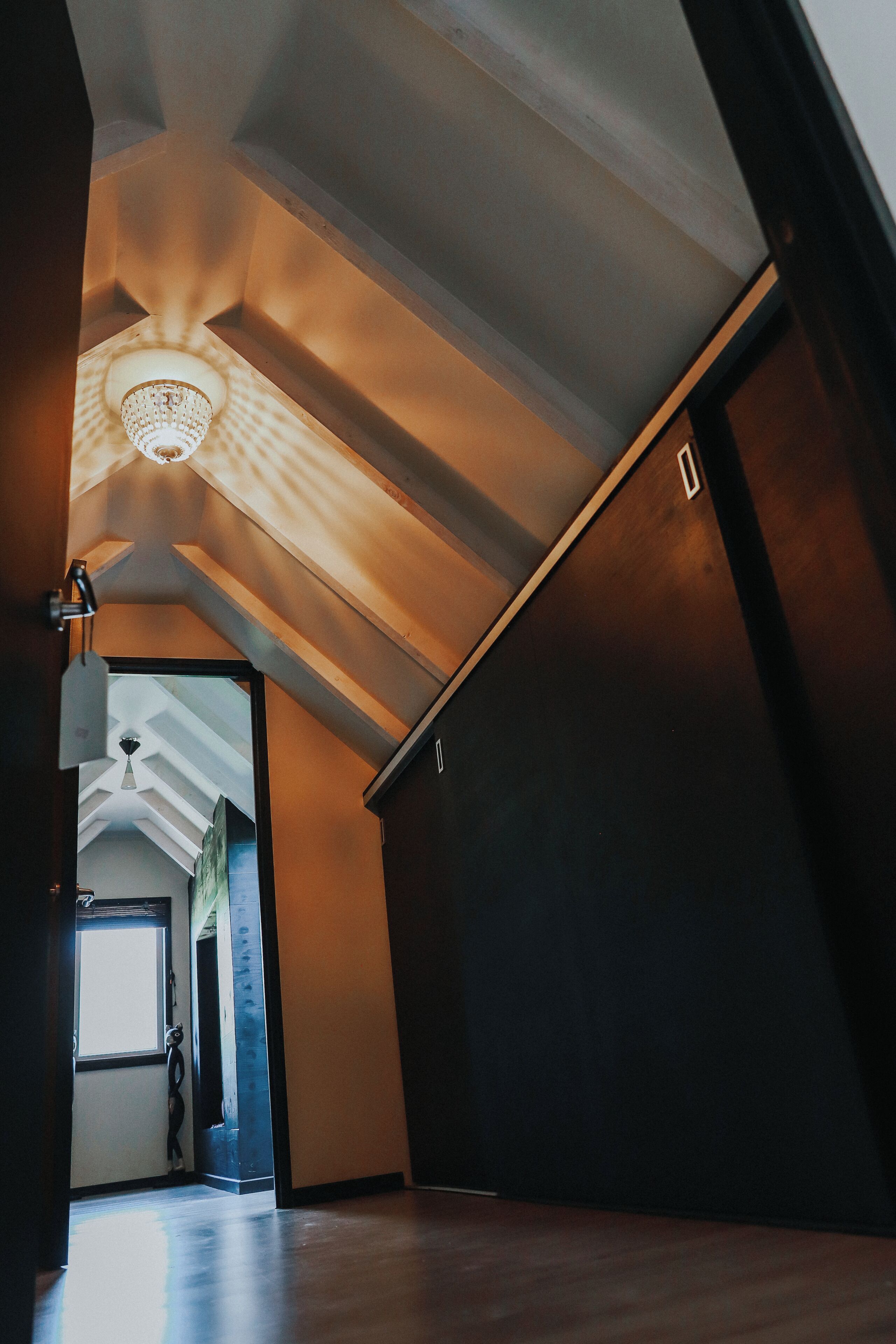 A spacious hallway with a high ceiling and a skylight.