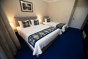 Deluxe Triple Room | 1 bedroom, minibar, individually furnished, desk