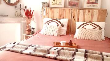 1 bedroom, desk, iron/ironing board, travel crib