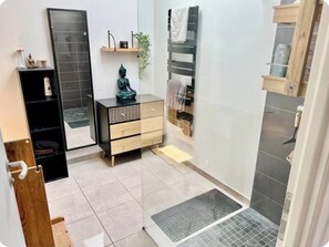 Shower, hair dryer, towels, soap