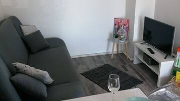 Apartment (One Bedroom Apartment with Terrace) | Living room | 32-inch flat-screen TV with digital channels