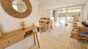 A modern kitchen with white cabinets and a central island. - House Jaulice - 8 min Pont l'Evêque - 10 people (Le Torquesne)
