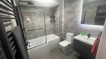 Apartment | Bathroom | Combined shower/tub, deep soaking tub, hair dryer, towels