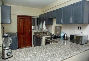 Apartment | Private kitchen | Fridge, microwave, oven, electric kettle