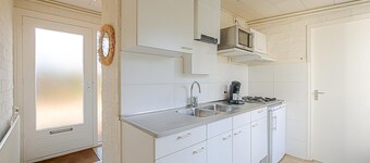 If you are looking for peace and comfort during your stay at Park Duinland, then Holiday Home Duinland 251 is the perfect choice. Located at the beginning of the park, this corner bungalow guarantees a serene environment for your family.