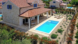A stone villa with a swimming pool, outdoor seating, and a garden. - Papa's court Mediterranean Pasman Villa with pool III (Pasman)