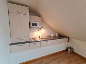 Fridge, electric kettle, cookware/dishes/utensils