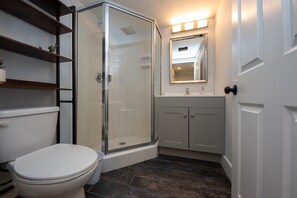 Shower, hair dryer, towels, shampoo