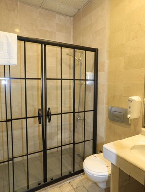 Shower, hair dryer, slippers, towels