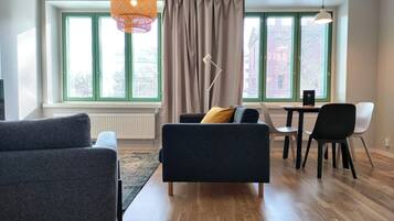 Standard Apartment | Living area | 32-inch TV with cable channels