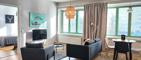 Standard Apartment | Living area | 32-inch TV with cable channels