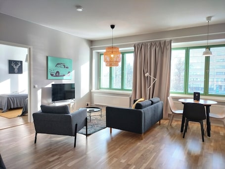 Standard Apartment | Living area | 32-inch TV with cable channels