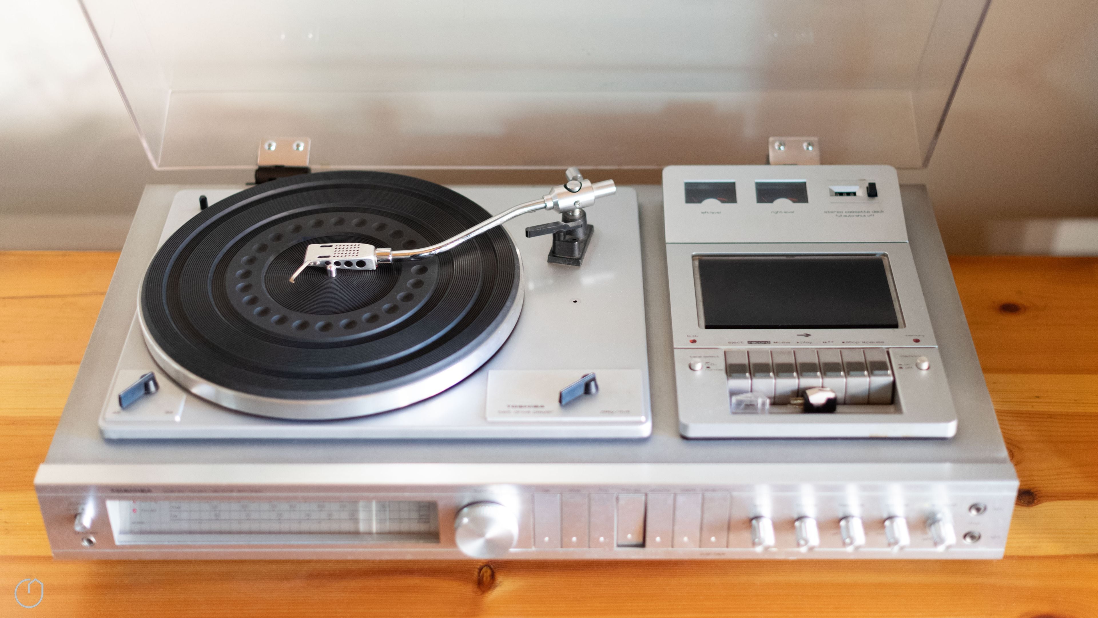 A turntable with a record player, a control panel, and a screen.