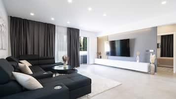 Exclusive Villa | Living area | 120-cm flat-screen TV with digital channels, TV, heated floors