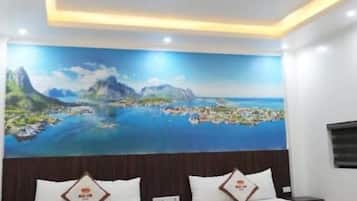 Deluxe Quadruple Room | Blackout drapes, iron/ironing board, free WiFi, bed sheets