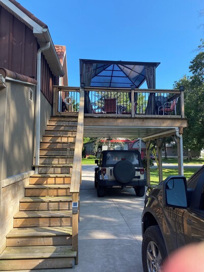 This unit sleeps 5 in two bedrooms and is a quick walk to the beach.