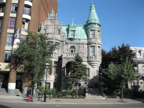 A historic building with ornate architecture, including a turret and a clock.