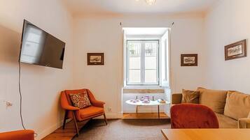 Superior appartement | Woonruimte | Een flatscreentelevisie