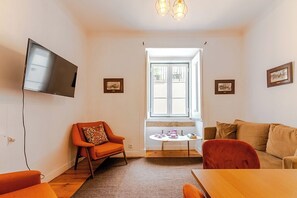 Superior Apartment | Living area | Flat-screen TV