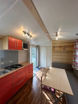 Fridge, microwave, stovetop, coffee/tea maker