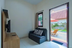 Family Triple Room | Living area