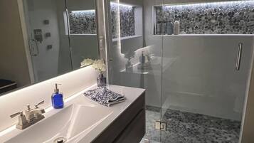 Shower, hair dryer, towels, soap