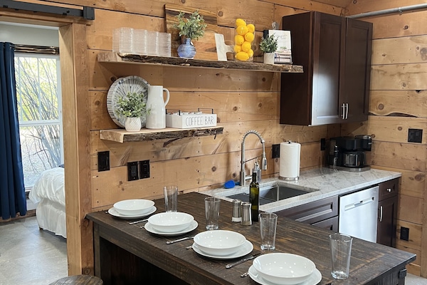 The dining table accommodates four people. Full-size sink and dishwasher.