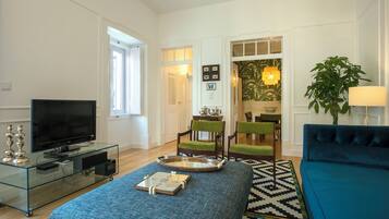 Deluxe Apartment, 3 Bedrooms, Kitchen, Garden Area | Living area | Flat-screen TV