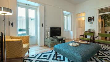 Deluxe Apartment, 3 Bedrooms, Kitchen, Garden Area | Living area | Flat-screen TV