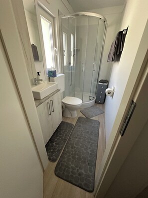 Shower, hair dryer, towels, soap
