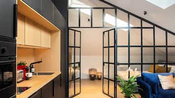 City Apartment (9) | Living area | 60-inch TV with cable channels