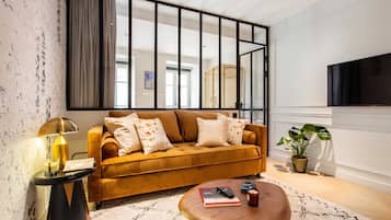 Family Apartment (4) | Living area | 60-inch TV with cable channels