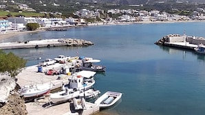 A coastal marina with boats docked, a clear sky, and a mountainous backdrop. - Sea View And Mountain View Apartment For 4 People (Ierapetra)