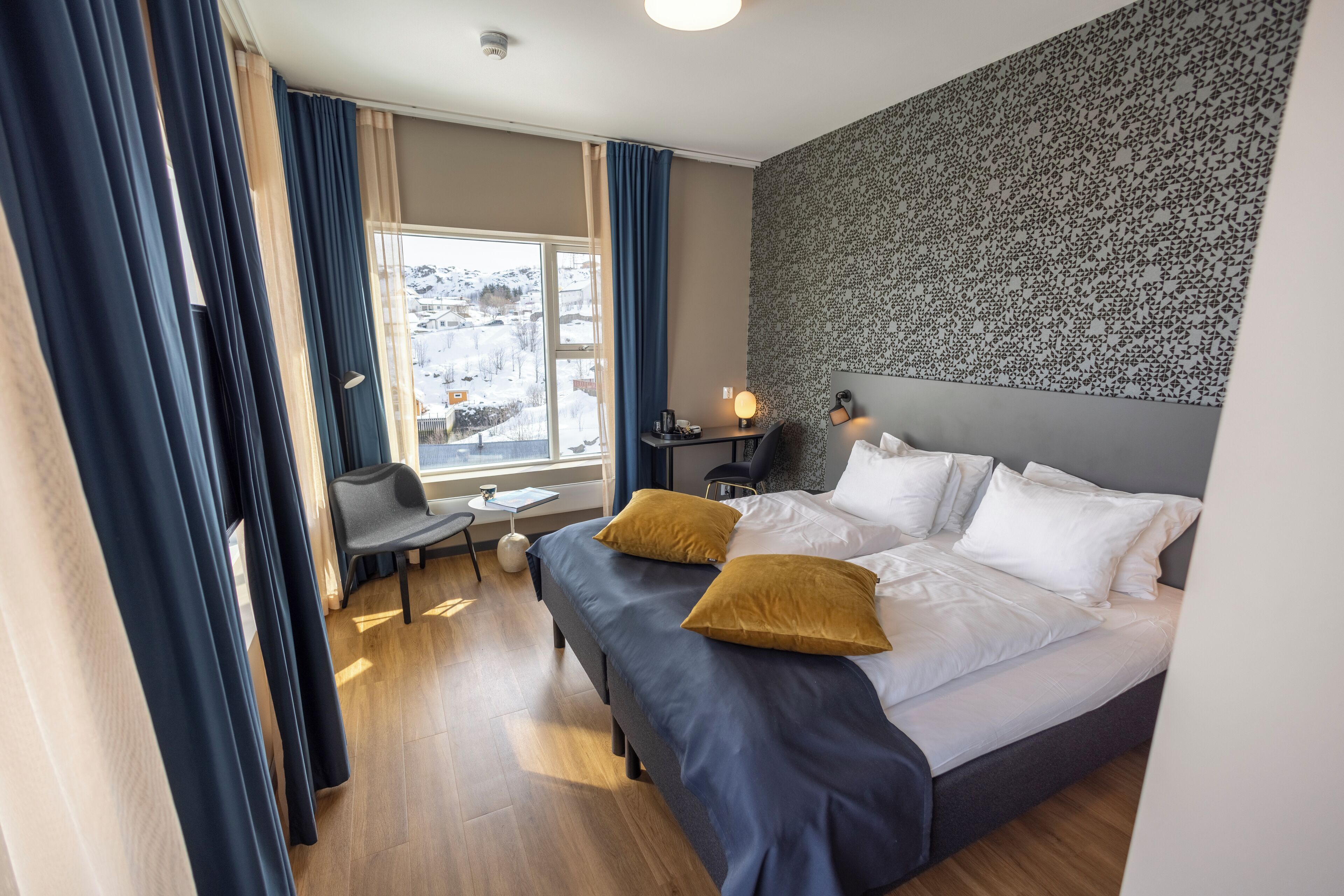 Down comforters, pillowtop beds, desk, laptop workspace