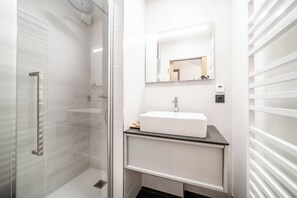 Eco-friendly toiletries, hair dryer, towels, shampoo
