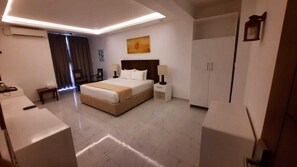 Habitació doble Deluxe, vistes a la platja | Cortines opaques i habitacions insonoritzades