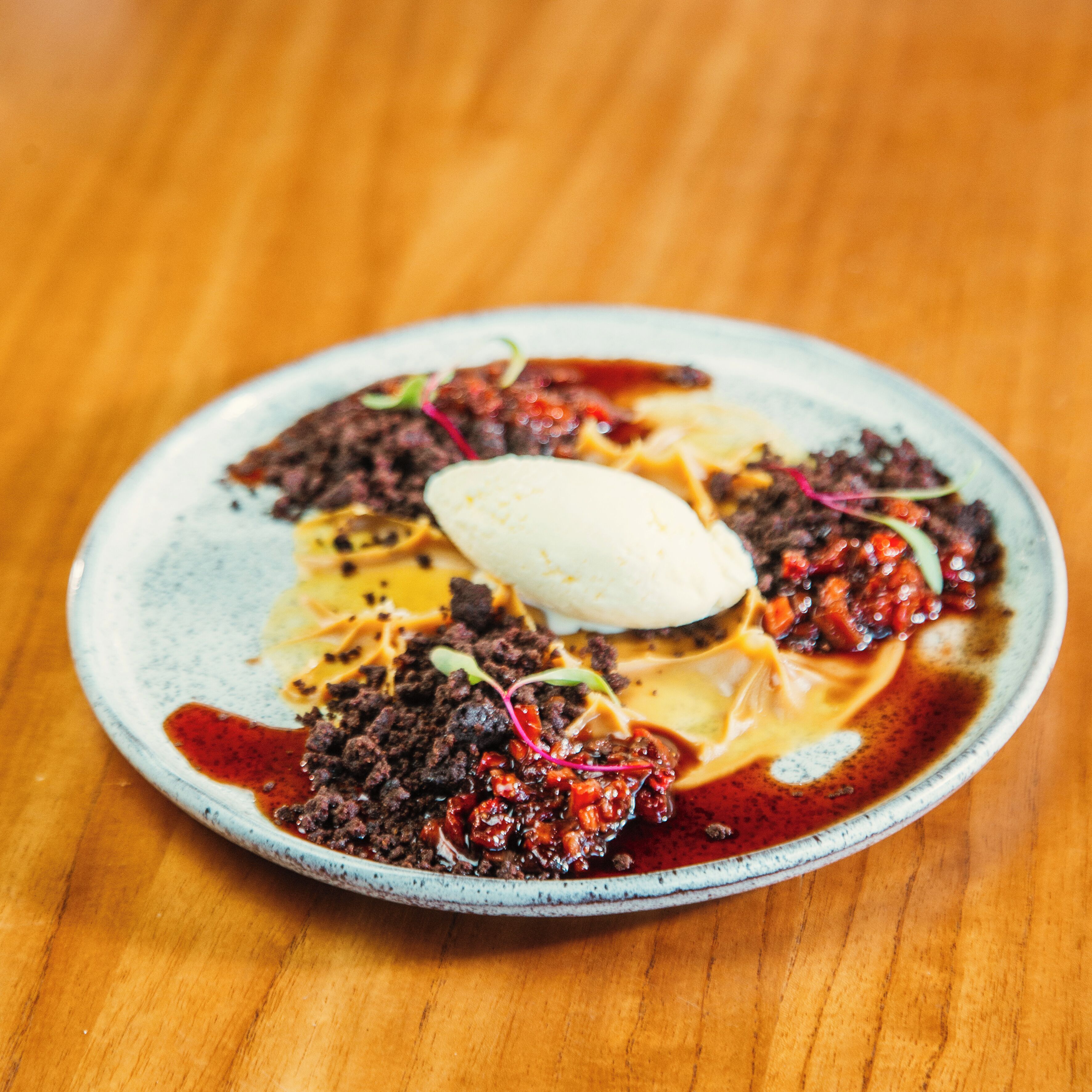 A plate of food with a scoop of ice cream on top.