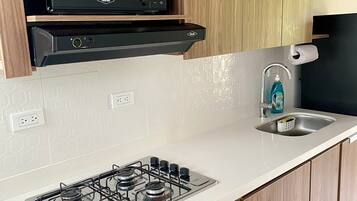 Microwave, coffee/tea maker, cookware/dishes/utensils, paper towels