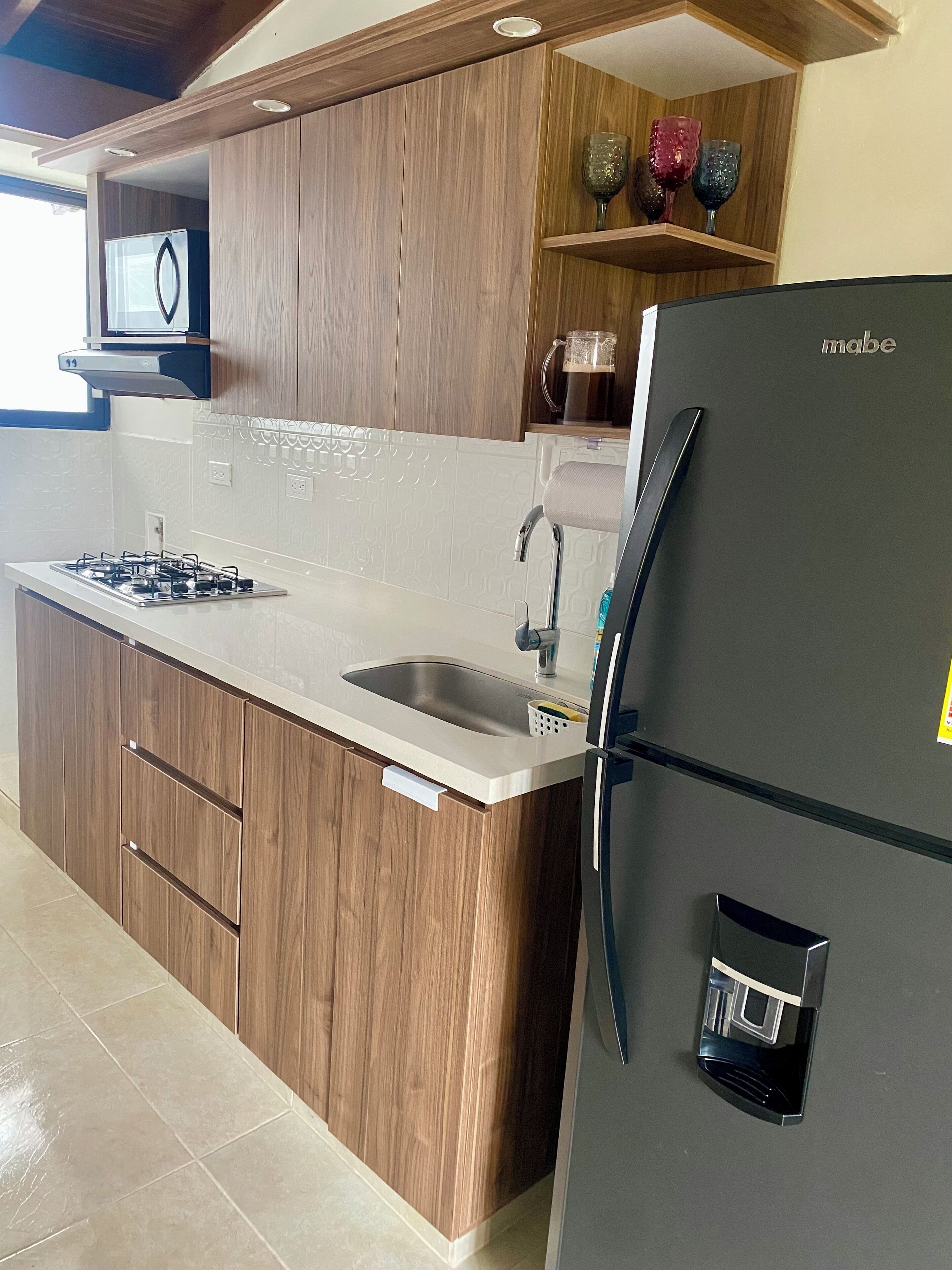 Microwave, coffee/tea maker, cookware/dishes/utensils, paper towels