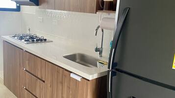 Microwave, coffee/tea maker, cookware/dishes/utensils, paper towels