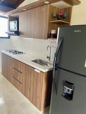 Microwave, coffee/tea maker, cookware/dishes/utensils, paper towels