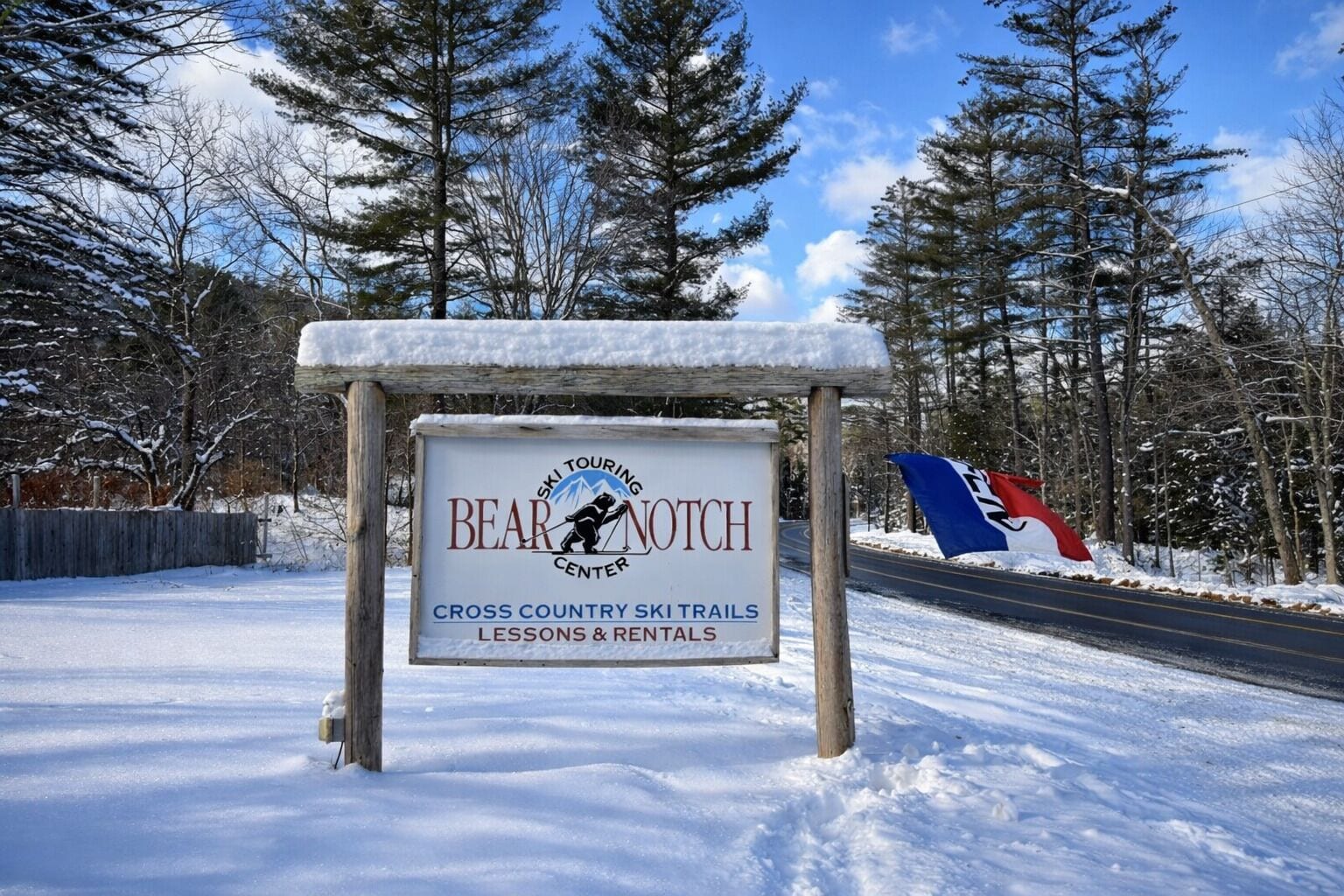A sign for the Bear Notch Ski Touring Center advertising cross-country ski trails, lessons, and rentals.