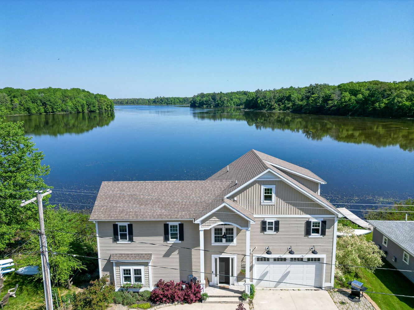 Luxury on Long Lake. Peaceful natural lakefront setting adjacent Gun Lake