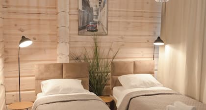 The house is located in a quiet area, surrounded by forest pines.