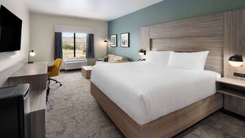 Suite, 1 King Bed (Golf) | Desk, laptop workspace, blackout drapes, iron/ironing board