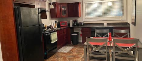 Coffee/tea maker, fridge, microwave, oven